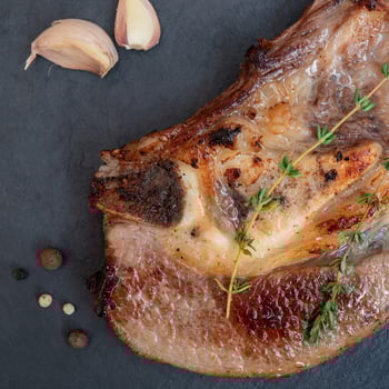 Breast of beef on the bone. Cooking in the kitchen. photo