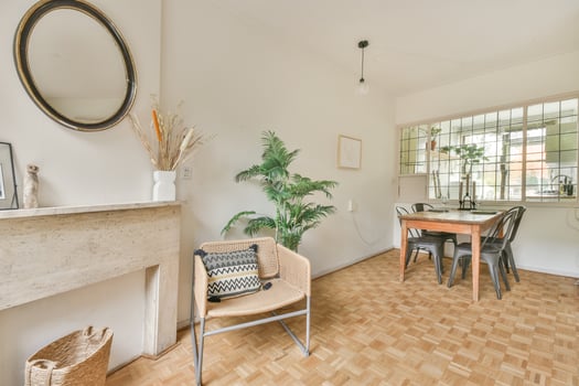 A living room with a table and chairs photo