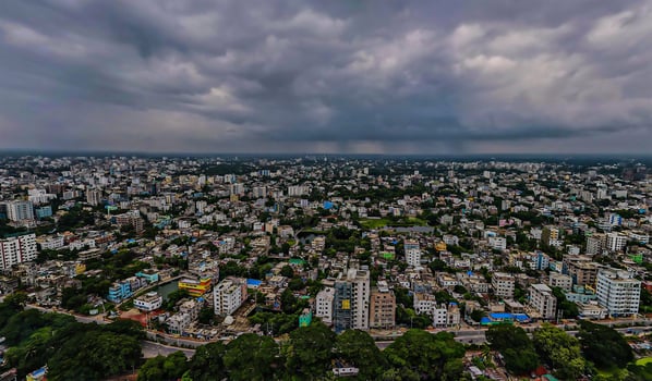 A city skyline with many buildings and trees photo