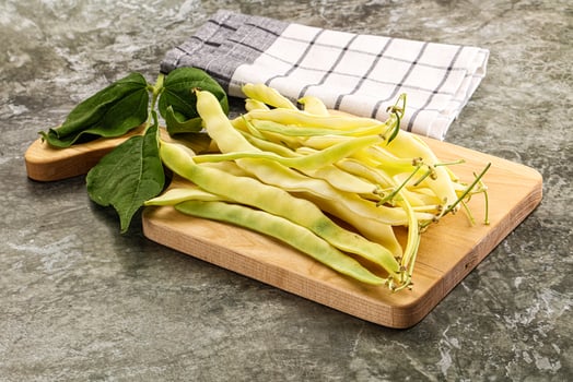 Raw green bean strings heap photo