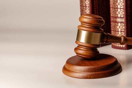Judge gavel and legal book close up on table photo