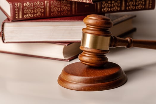 Judge gavel and legal book close up on table photo