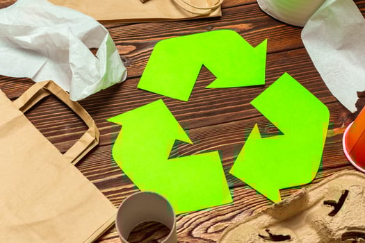 Eco concept with recycling symbol on table background top view photo