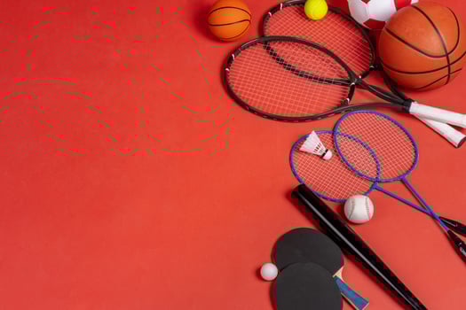 Sport equipment flat lay. Variety of rackets and balls photo