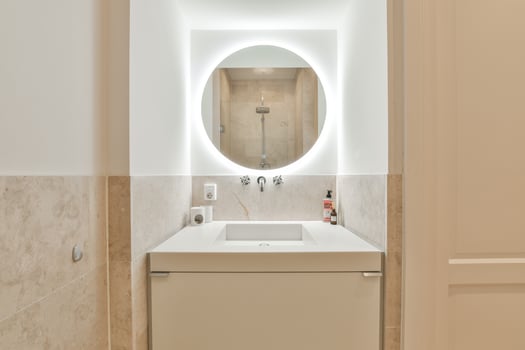 A bathroom with a sink and a mirror photo