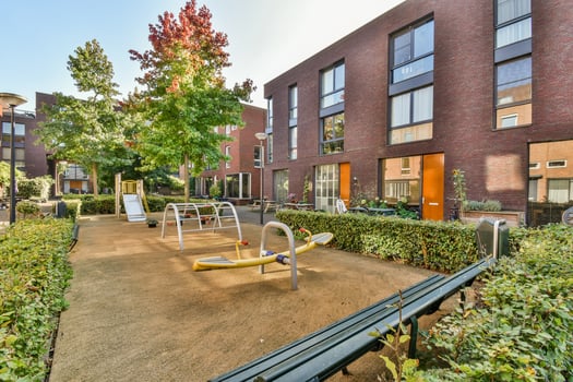 A playground in front of a building photo