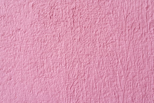 Gray stucco on wall of house. Construction industry. photo