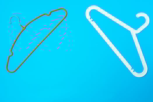 Blue hanger on trendy blue color background. Template fashion blog social media. photo