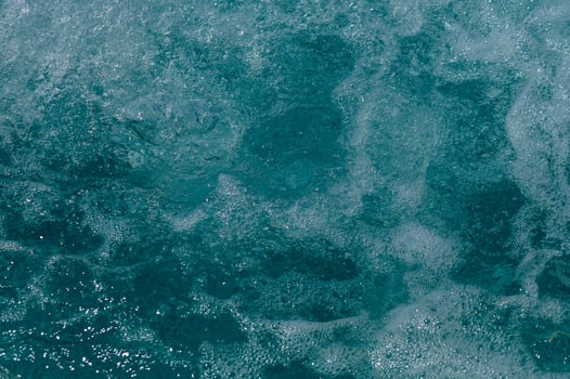 Seamless texture of blue pool water surface with ripples photo