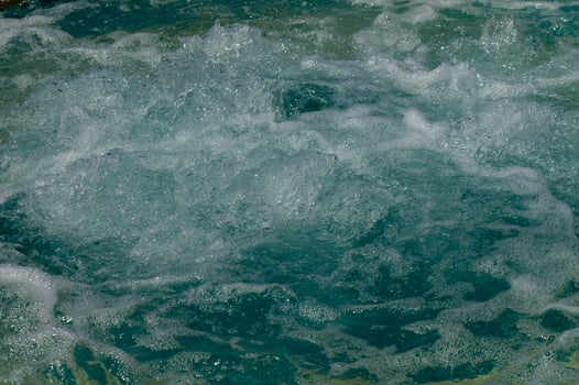 Texture of water in swimming pool for background photo