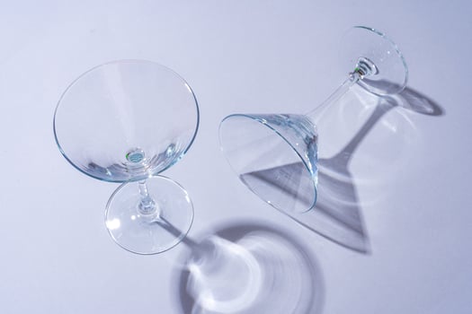 Two empty wine glass on gray background top view photo