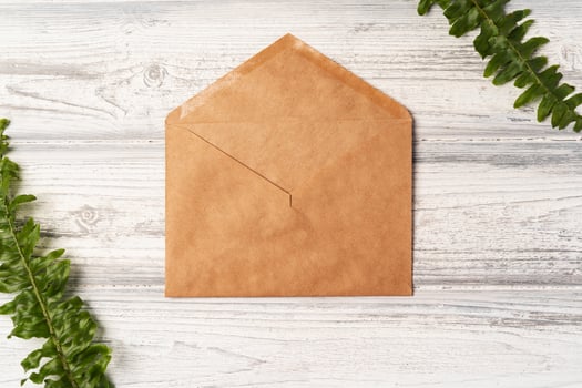 envelope and blank paper card with copy space mock up. photo