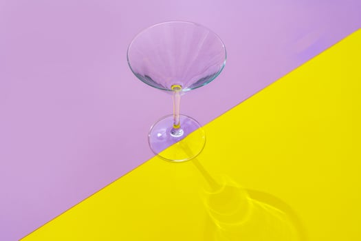 Empty transparent glass on a color background with copyspace. photo