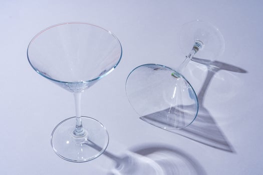 Two empty wine glass on gray background top view photo