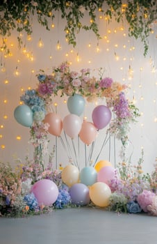 A whimsical birthday setup with a floral arch, pastel-colored balloons, and fairy lights hanging in the background, perfect for a dreamy celebration photo