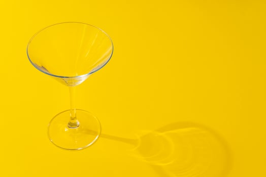Empty transparent glass on a color background with copyspace. photo