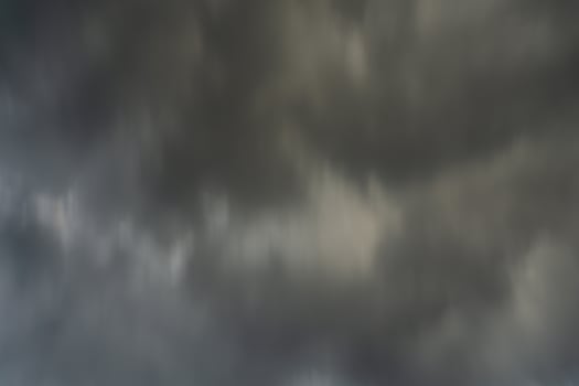 background of dark clouds during the day, with beautiful gray and rainbow colors photo