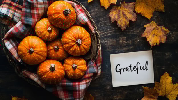 Autumn Pumpkin Thanksgiving Still Life With Plaid Blanket and Maple Leaves photo