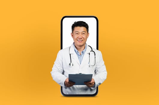 Asian mature man doctor provides health advice through a smartphone, standing inside the screen in a serene and professional setting photo