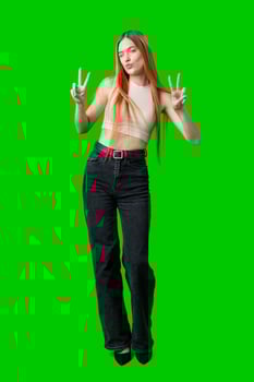 Woman Making Peace Sign Gesture in Front of Green Screen photo