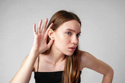 Young Woman Listening Attentively to a Conversation photo