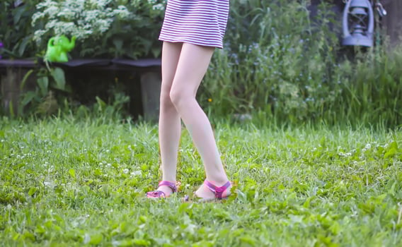 Little child enjoys summer vacation on a farm yard. photo