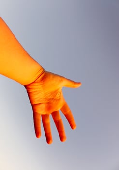 Woman's hand on blue sky background photo