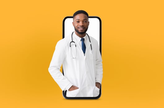 African American doctor with a stethoscope, wearing a white lab coat and a blue tie, emerges from a smartphone screen, symbolizing telemedicine on a vibrant yellow backdrop. photo