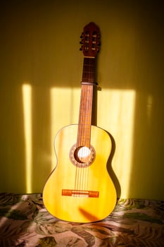 Classic guitar in the room interior. photo