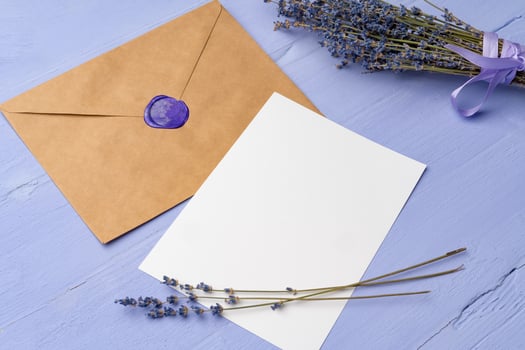 Letter envelope on lavender wooden background, copy space photo