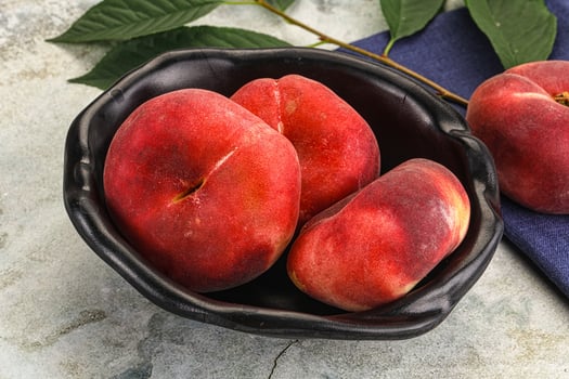 Ripe sweet and juicy Flat peach photo