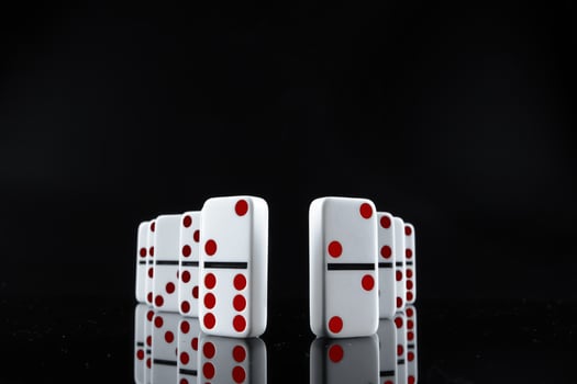 Domino game. Dominoes on a black table photo