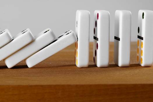 White domino dice on a wooden table photo