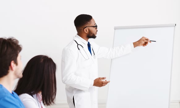 Weekly Meeting. Team Of Doctors Having Brainstorming Session In Conference Room photo
