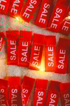 Cozy sweater adorned with holiday sale tags photo