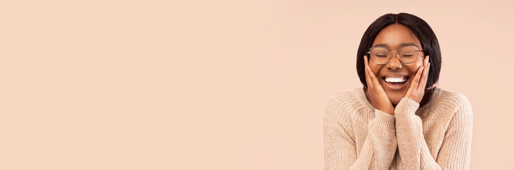 Happiness. Excited Black Lady Smiling Touching Face Posing On Pink Studio Background. Panorama, Empty Space For Text photo