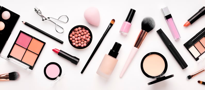Set of cosmetic products for makeup with natural brushes on white background, panorama photo