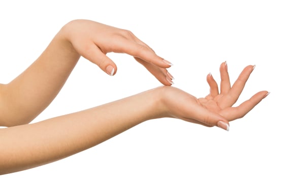 Beauty and skincare concept - beautiful female hands with french manicure, woman touching skin after spa treatment isolated on studio white background, close-up, cutout photo