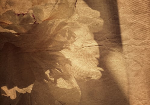 Vintage floral background with aged paper texture overlay. photo