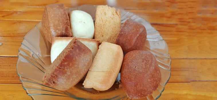 Fried mantau bread or roti mantau is served on a plate photo