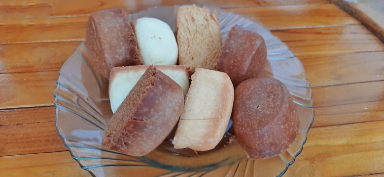 Fried mantau bread or roti mantau is served on a plate photo