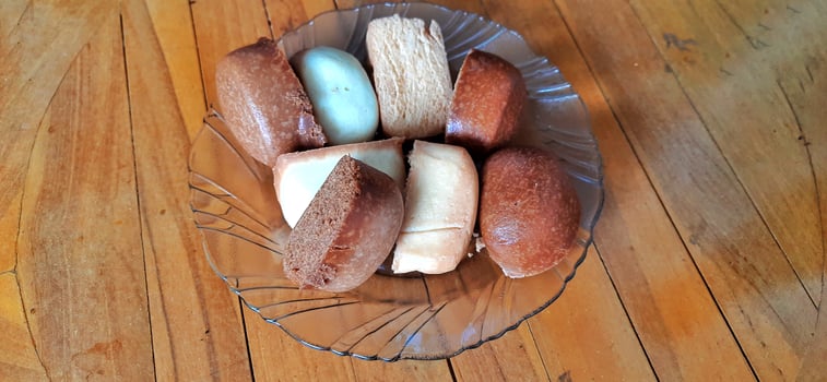 Fried mantau bread or roti mantau is served on a plate photo