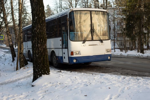 Public transport in winter. Bus parking. Old car. photo
