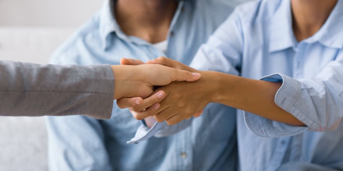 Effective Marital Therapy. Thankful Afro Spouses Handshaking With Relationship Coach In Office. Selective Focus, Panorama photo