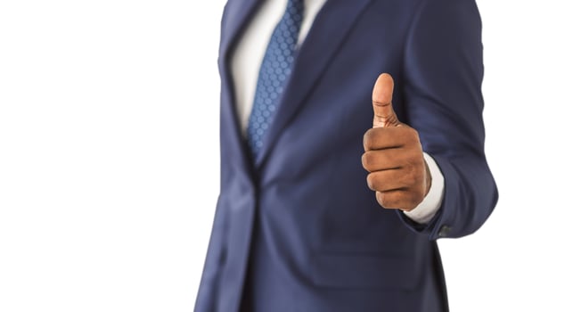 Excellent. Close-up of african man in formal wear showing his thumb up photo