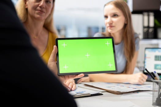 Financial adviser assisting clients in setting up investment accounts with green screen tablet, conducting audit. Consultant uses financial planning software on mockup device to help family, close up photo