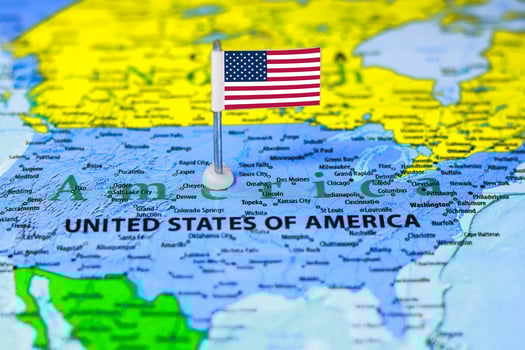 United States of America flag on the map with selective focus and shallow DOF photo