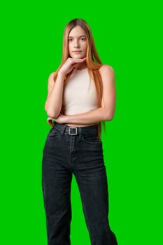 Woman With Long Hair Contemplating While Posing Against a Green Screen photo