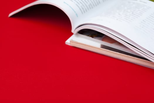 Close up stacking magazine place on table background photo