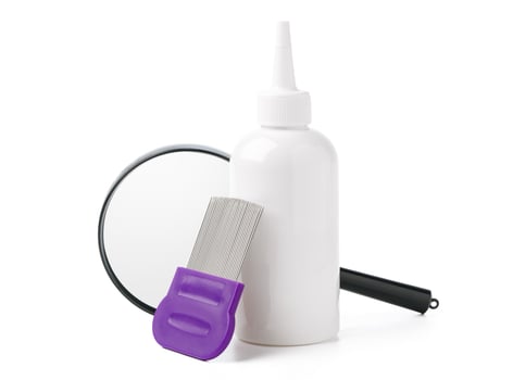 Medicine, lice comb and magnifying glass isolated on white photo